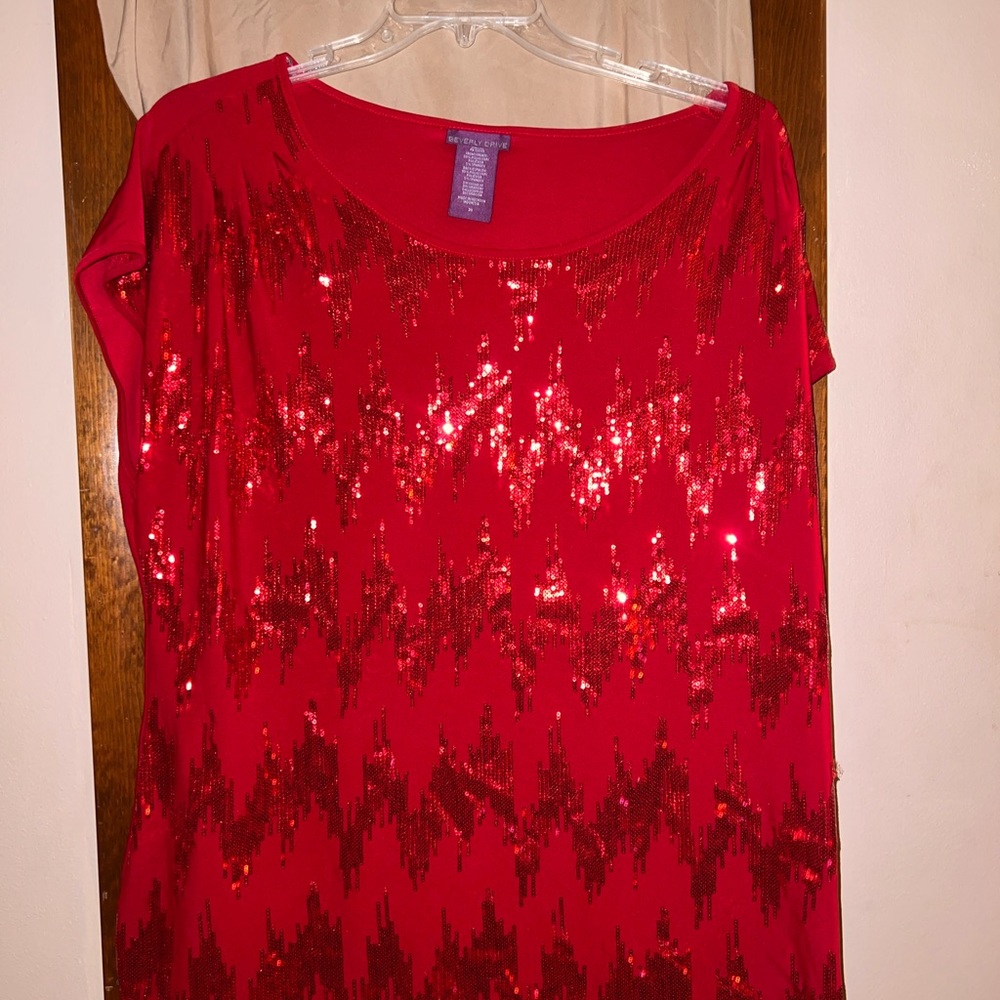 Sequin Holiday party blouse. 5% spandex.